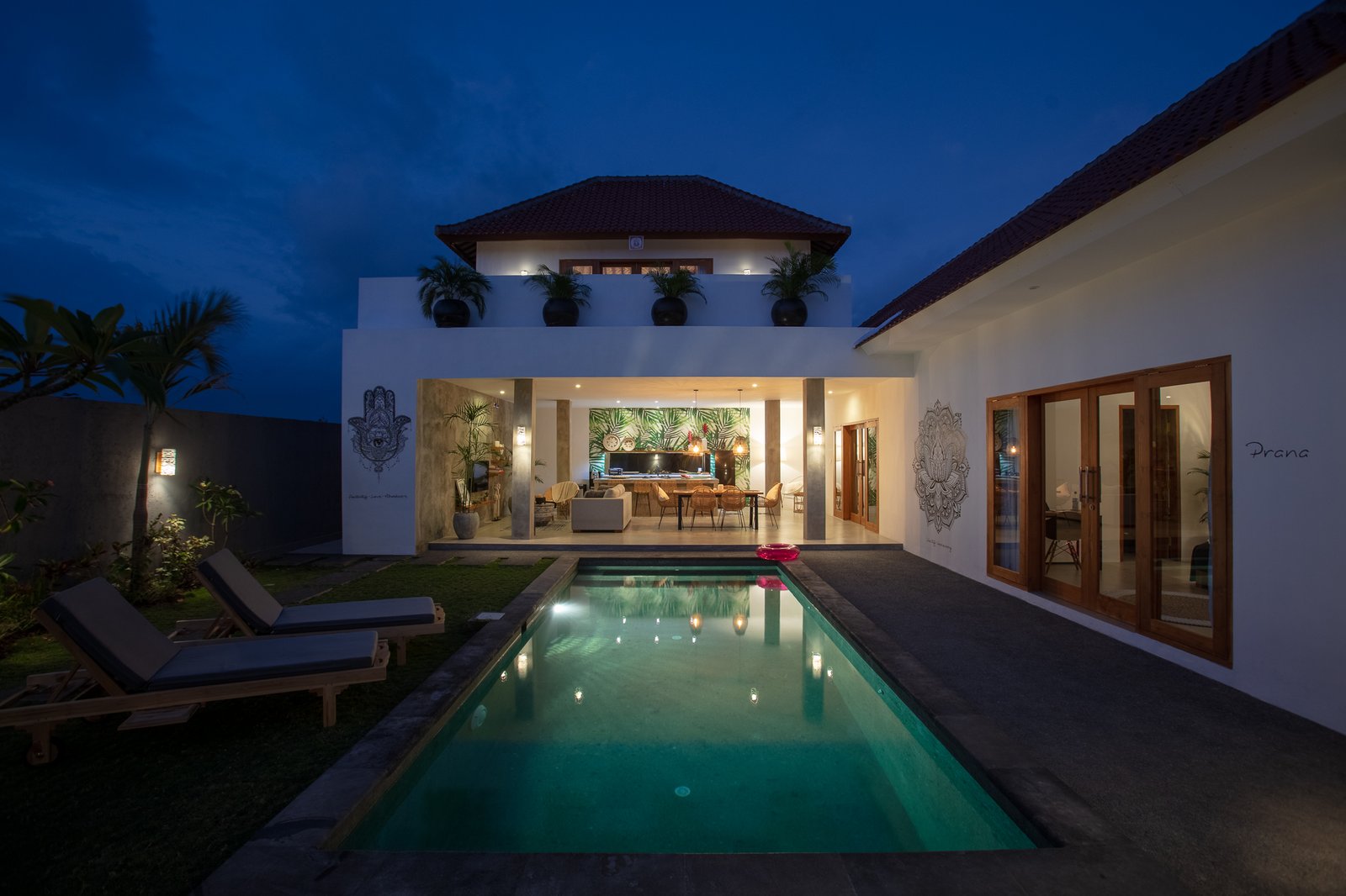 Photo of a villa by night.